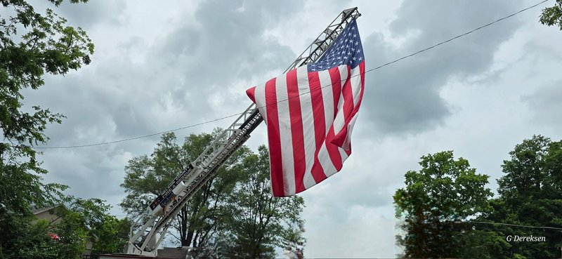 American flag on fire truck ladder
